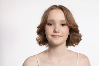 A captivating portrait of a stunning young woman with wavy hair, showcasing her confidence and