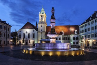 City of Bratislava at night in Slovakia, Roland Fountain, Old Town Hall building and Jesuit Church