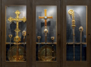Chester, United Kingdom, 26 August, 2022: ornate golden crosses and Bishop staff in a display case