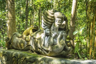 Monkey sculpture in sacred Monkey Forest park, Ubud, Bali, Indonesia