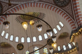 Bright Lamps on circular chandelier in a big mosque