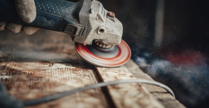 A grinder on wood creating dust and spirals, focused and dynamic