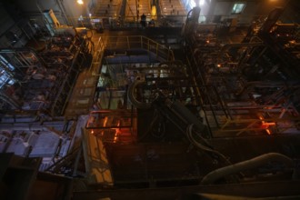 Glassworks. Industrial furnace for the production of glass in the factory workshop