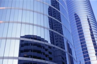 Blue mirror glass facade skyscraper buildings city of Houston Texas