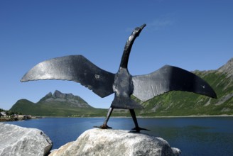 Sculpture of a cormorant at the harbour in Gryllefjord, Senja, Troms, Norway