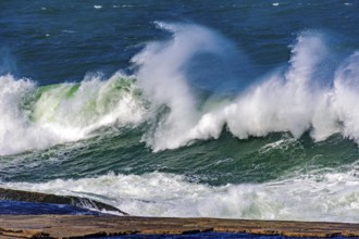 Big, dangerous waves during tropical storm in the green and blue waters of Rio de Janeiro, Brazil