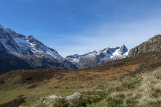 Beautiful autumn landscape in the central Alps, Switzerland. Orange colours and alpine wilderness