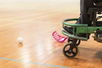 Photo of disabled man on a wheelchair playing sports, hockey, International wheelchair amputee
