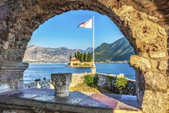 View on St George island from Our Lady of the Rocks through arch. Perast, Montenegro