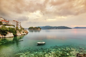 The sunrise at the old port in the Chora of Skiathos island, Greece