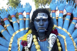 Man dress as Hindu Goddess Kali near Mutharamman temple, Tamil Nadu, India, Asia