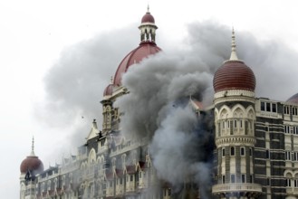 Smoke emits from Taj Mahal Hotel during terrorist attack, Bombay Mumbai, Maharashtra, India