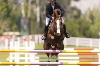 Jordan Coyle of Ireland and riding Jorisca, compete in the 1.60m Grand Prix during The Continental