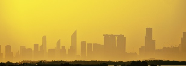 Sandstorm, samum, haboob over the southern megalopolis, the outline of skyscrapers are drowning in