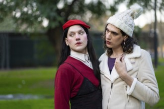 Couple of transgender women posing sensually in a park