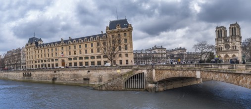 Cityscape in Paris with the Seine river, historical cathedral and buildings, an antique bridge, on