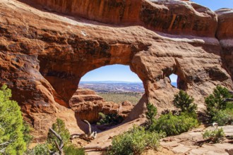 Double O Arch. The beauty of Arches Park in USA. Picturesque red-brown sandstone cliffs form a