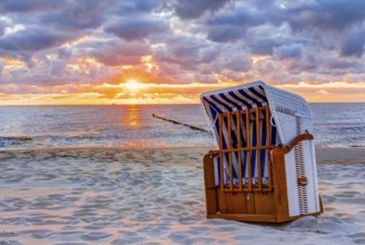 Wonderful sunrise at the beach in summer with beach chair