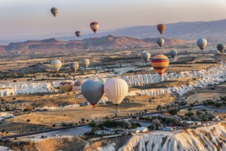 Hot air balloons in the valleys of Cappdocia at sunrise, Turkey