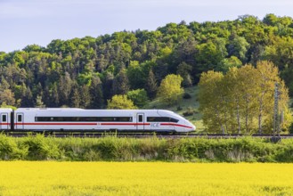 InterCityExpress ICE travelling across the Swabian Alb. Idyllic landscape in spring. Lonsee,
