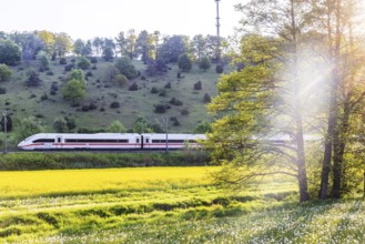 InterCityExpress ICE travelling across the Swabian Alb. Idyllic landscape in spring. Lonsee,