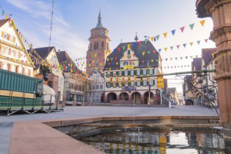 Lively town view with pennants and a bell tower in historical surroundings, Fasnet, Weil der Stadt,