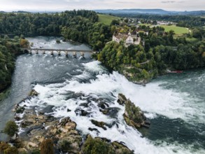 Aerial view of the Rhine Falls with railway viaduct and Laufen Castle in autumn, Neuhausen, Canton