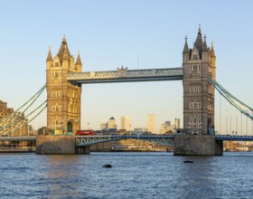 Tower Bridge in sunshine at dusk, River Thames from Southwark, London, England, UK