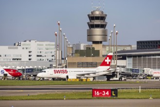 Swiss airline aircraft at Zurich Airport. Terminal and tower. Zurich, Switzerland