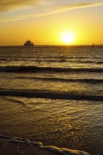Intense sunset on the west beach of Norderney, Lower Saxony, Germany