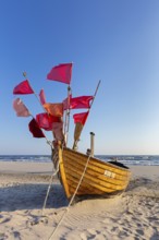 Traditional wooden fishing boat on the beach along the Baltic Sea at Stubbenfelde, Loddin on the