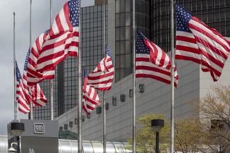 Detroit, Michigan - American flags flying in front of the General Motors headquarters in the