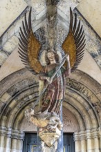 Tower porch with statue of St Michael the Archangel. Protestant parish church of St Michael. As