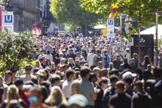 Many people on the way in the pedestrian zone Königsstraße. Crowd in Stuttgart, Baden-Württemberg,