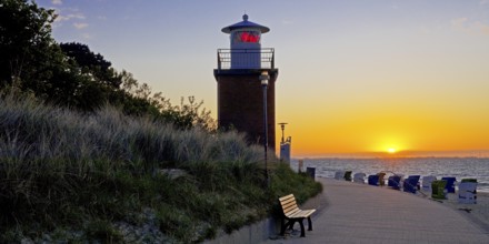 Olhörn lighthouse at colourful sunrise over the sea on the North Frisian island of Föhr,