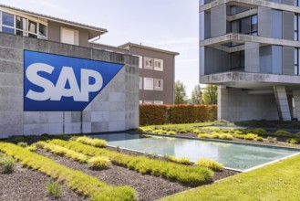 Logo and building of the listed software company SAP, headquarters. Walldorf, Baden-Württemberg,