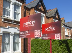 Estate agent property signs outside houses for sale, Barry Road, East Dulwich, London SE22,