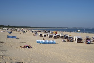 Beach chairs and tourists on the sandy beach, Swinemünde, Usedom Island, Baltic Sea, Poland