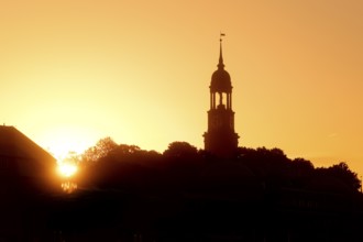 Church tower of the main church St Michaelis, called Michel, at atmospheric sunrise, Hamburg,
