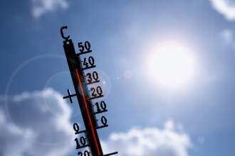 Symbolic image heat wave, thermometer in the sun, summer, climate change, temperature, record heat,