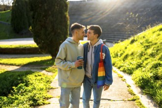 Romantic gay couple enjoying a sunny day in the park, sharing tender moments of love and affection