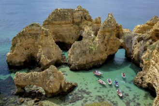 Excursion boats on the rocky coast near Lagos, Algarve, Portugal