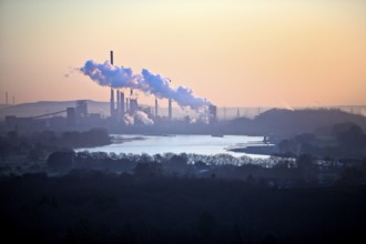 View in front of sunrise from the Rheinpreussen spoil tip onto the Rhine in Duisburg with the