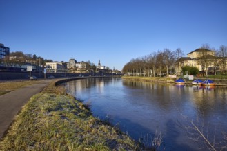 River Saar, bank, trees, meadow, reflections on the water surface, footpath and cycle path,