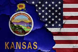 Flags of Kansas and USA painted on cracked wall