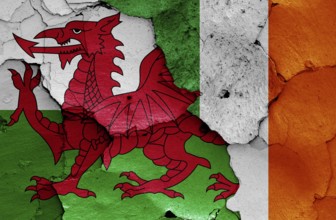 Flags of Wales and Ireland painted on cracked wall