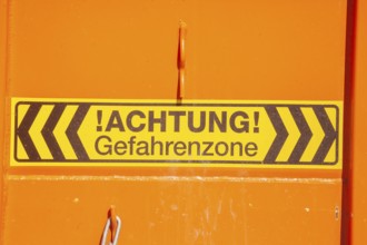 Caution danger zone sign at a construction site, Germany