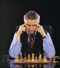 A man plays chess and thinks, 60, years, seniors, senior studio shot, Lower Saxony, Federal