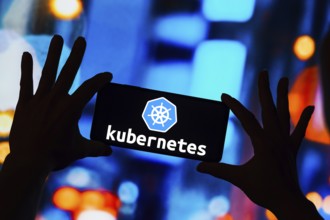 In this photo illustration, the Kubernetes logo seen displayed on a smartphone