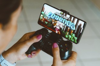 In this photo illustration, the Minecraft Legends logo is displayed on a smartphone screen as a